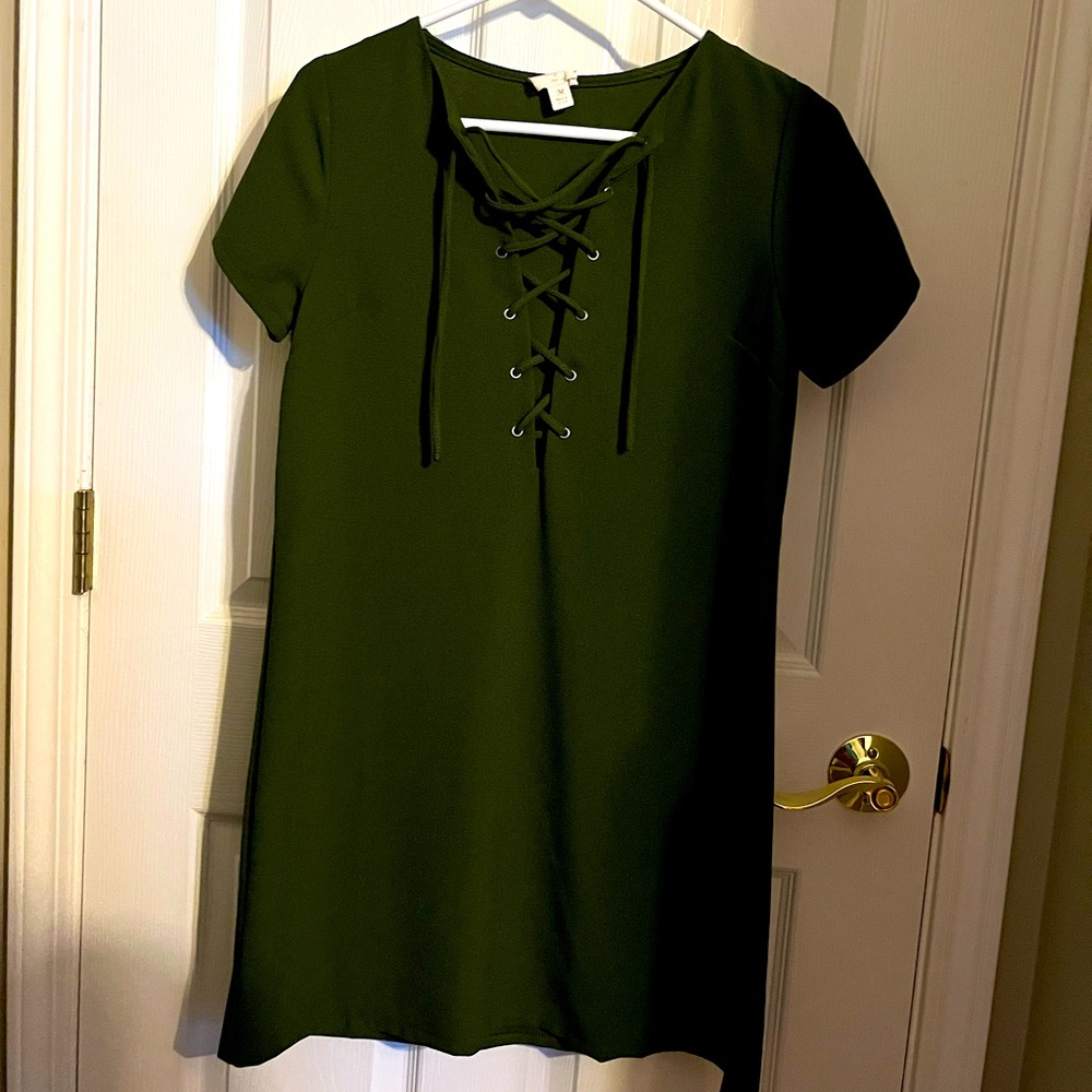 Olive green shift dress with short sleeves and lace up detail w/ silver grommets